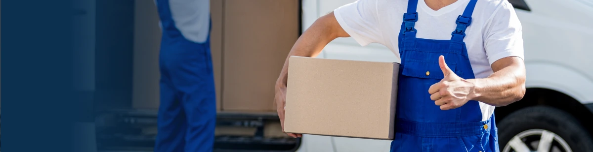 Relocation specialist carrying a packed box